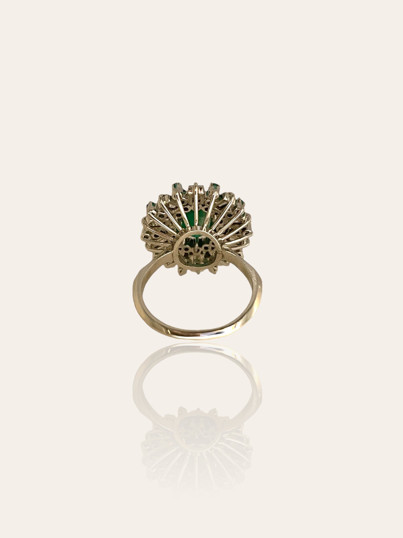 1960s/1970s white gold cocktail ring set with emerald, baguette and brilliant cut diamonds
