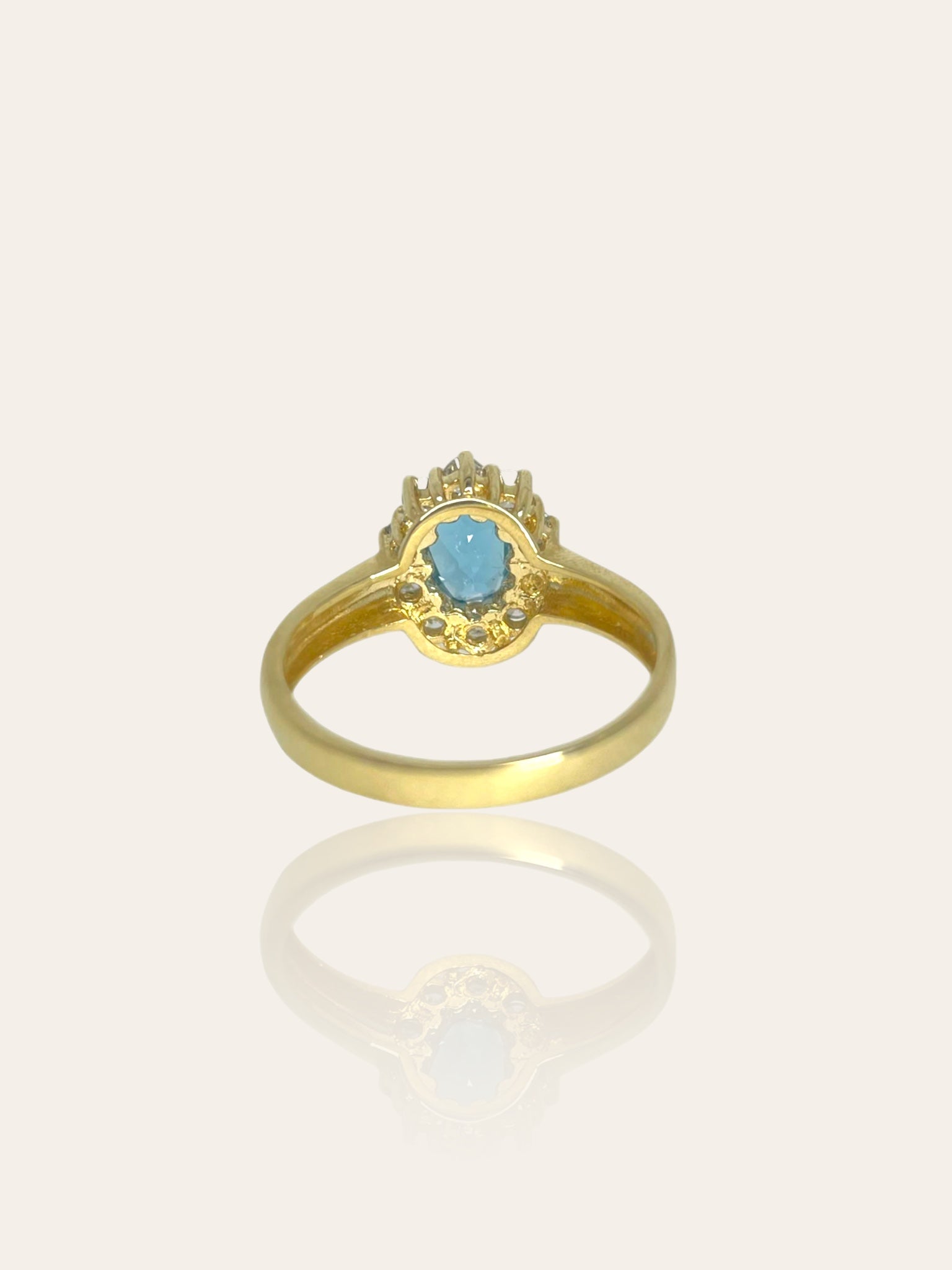 14K yellow gold entourage ring set with sky blue topaz and brilliant cut diamonds